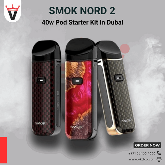 Three Smok Nord 2 40w pod starter kits in red, gold, and black colors with smoke background and Vape King DXB logo.